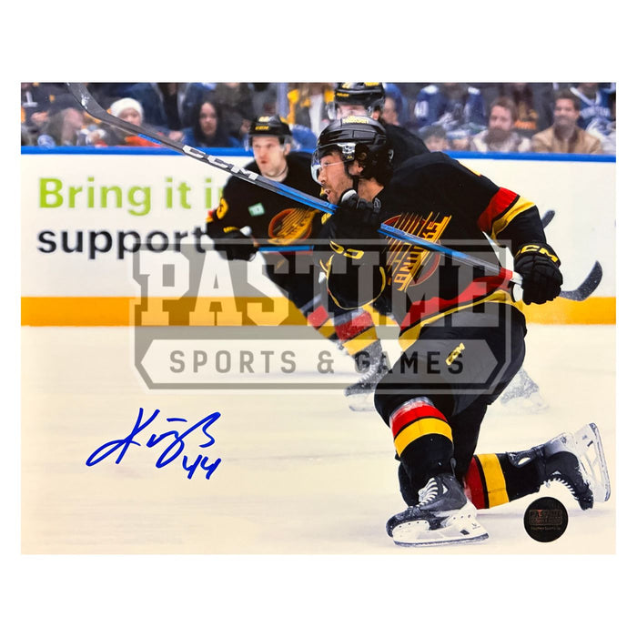 Kiefer Sherwood Autographed Vancouver Canucks Hockey Photo (Shooting The Puck)
