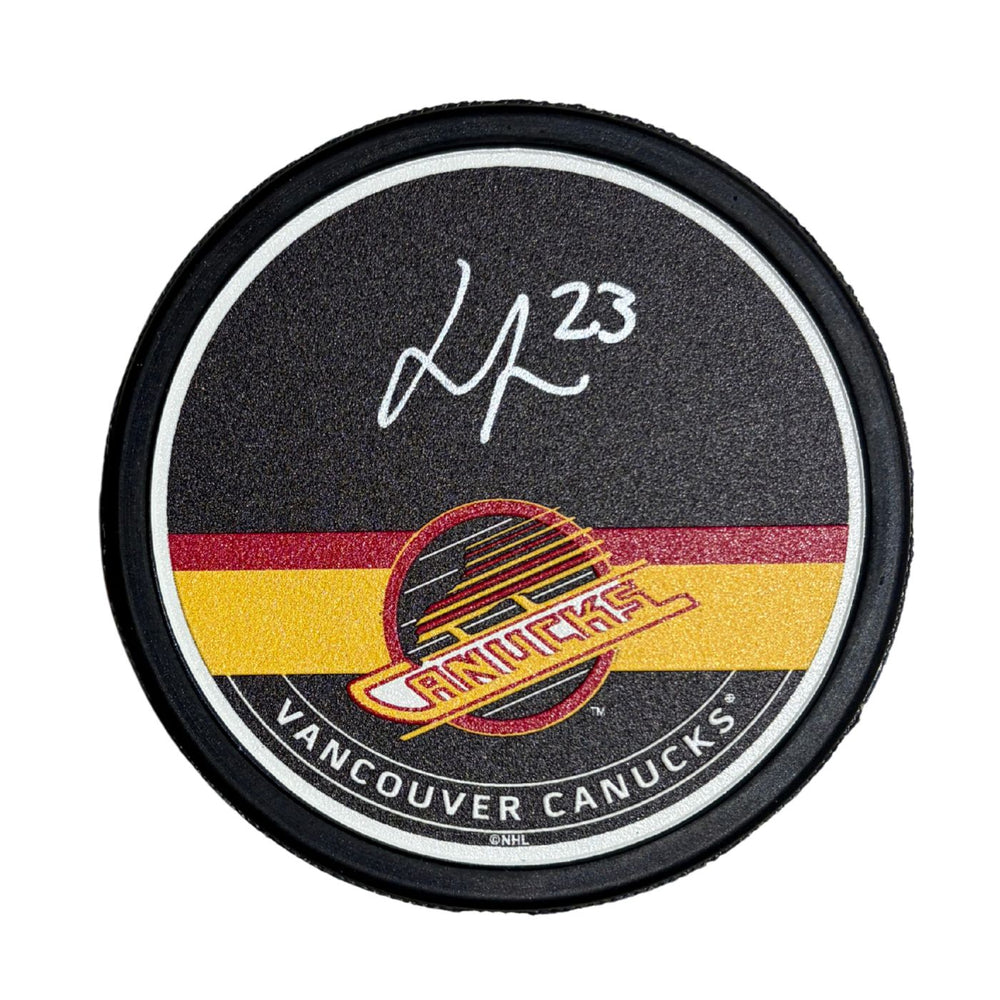 Jonathan Lekkerimaki Autographed Vancouver Canucks Hockey Puck (Textured Mustang Skate Autograph Puck) - Pastime Sports & Games