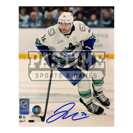 Jake Debrusk Autographed Vancouver Canucks Hockey Photo (Skating 1)
