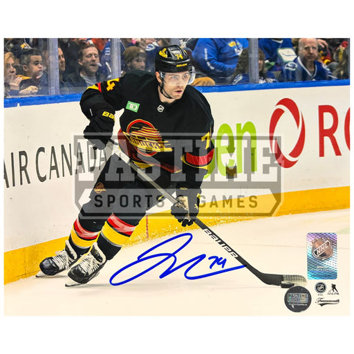 Jake Debrusk Autographed Vancouver Canucks Hockey Photo (Skating 3)