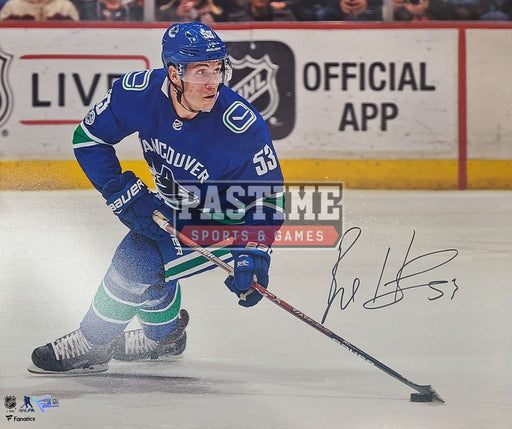 Bo Horvat Autographed 16X20 Vancouver Canucks Home Jersey (Skating W/ Puck) - Pastime Sports & Games
