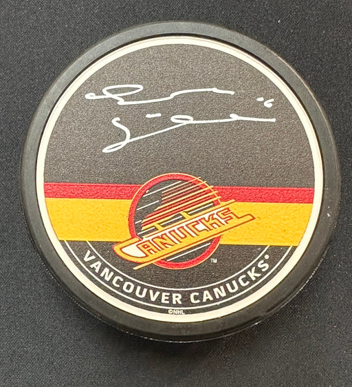 Trevor Linden Autographed Vancouver Canucks Skate Hockey Puck (Textured Mustang Autograph Puck)