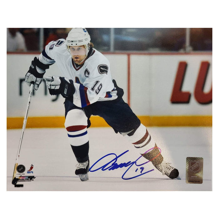 Markus Naslund Autographed Vancouver Canucks Photo (White Skating With Puck) - Pastime Sports & Games