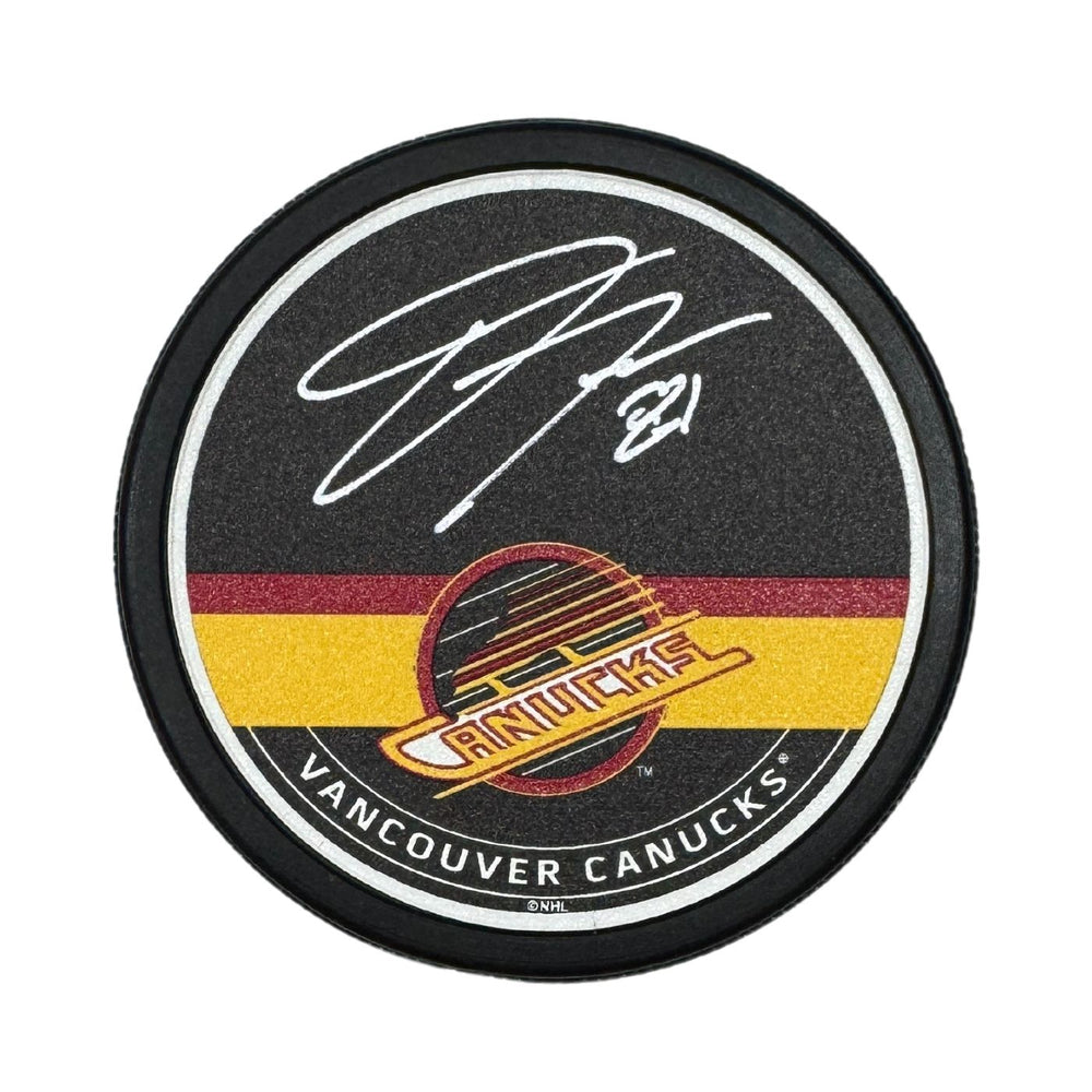 Dakota Joshua Autographed Vancouver Canucks Skate Hockey Puck (Textured Mustang Autograph Puck)