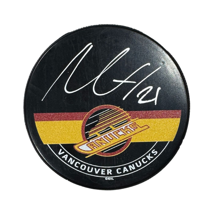 Nils Höglander Autographed Vancouver Canucks Skate Hockey Puck (Printed Mustang Autograph Puck)