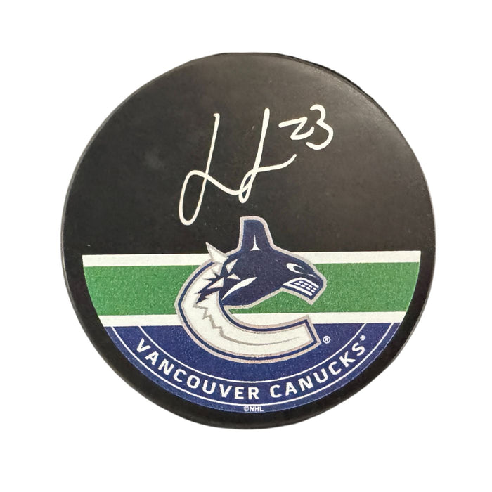 Jonathan Lekkerimaki Autographed Vancouver Canucks Hockey Puck (Printed Mustang Autograph Puck) - Pastime Sports & Games