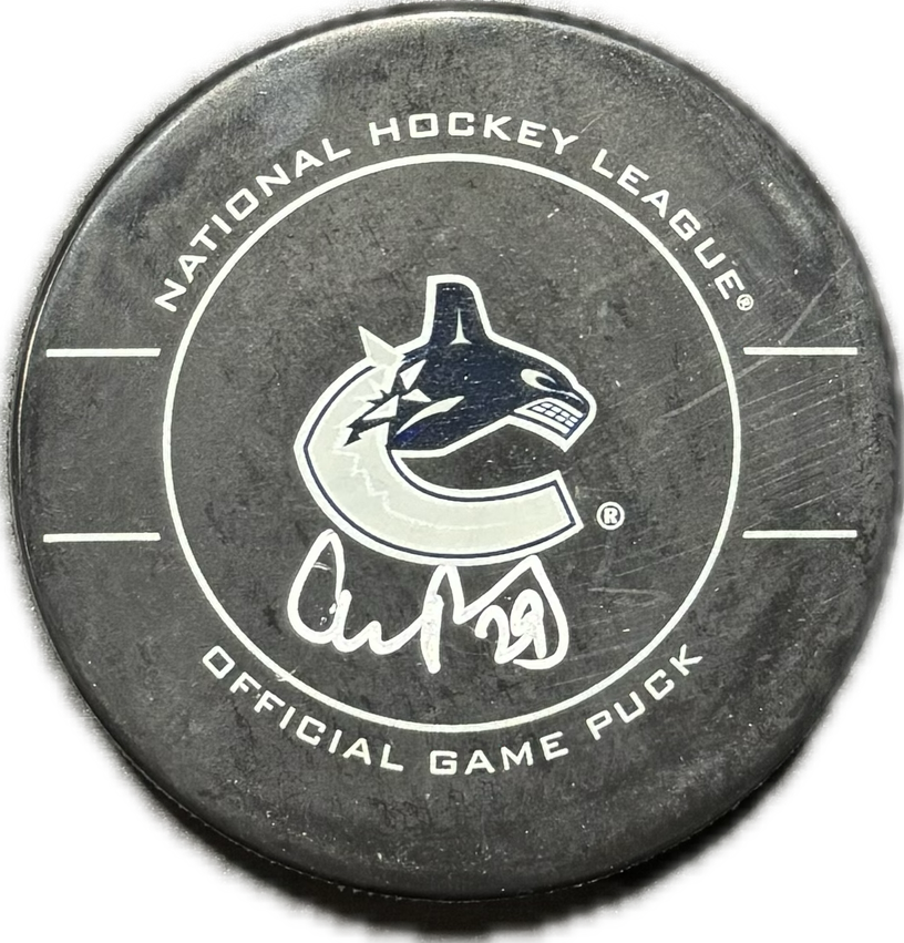 Aaron Rome Autographed Vancouver Canucks Hockey Puck (Official Game Puck)