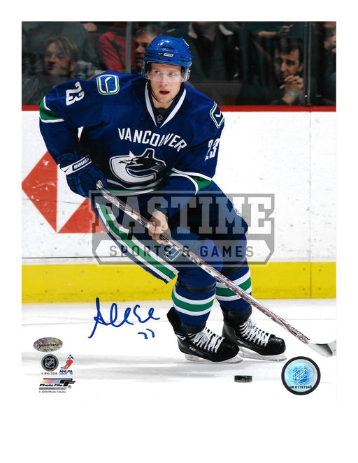 Alexander Edler Autographed 8X10 Vancouver Canucks Home Jersey (Skating With Puck) - Pastime Sports & Games