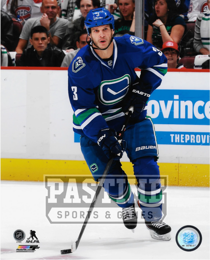 Kevin Bieksa 8X10 Canucks Home Jersey (Skating With Puck Crowd in Back) - Pastime Sports & Games