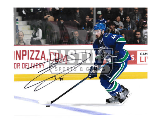 Eric Gudbranson Autographed 8X10 Vancouver Canucks Home Jersey (Skating To the Left) - Pastime Sports & Games