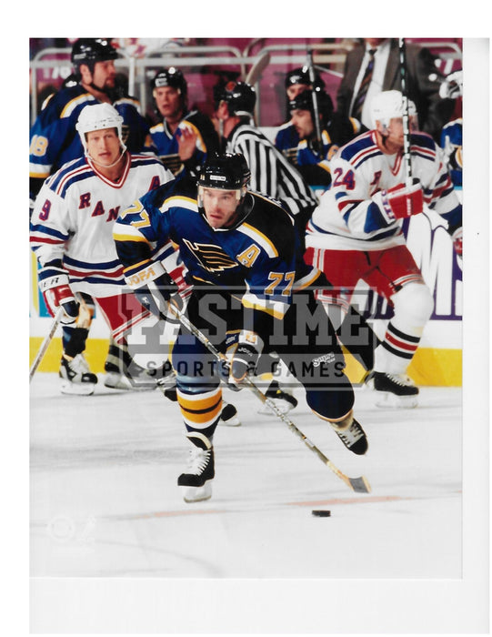 Pierre Turgeon 8X10 St. Louis Blues Home Jersey (Skating With Puck) - Pastime Sports & Games