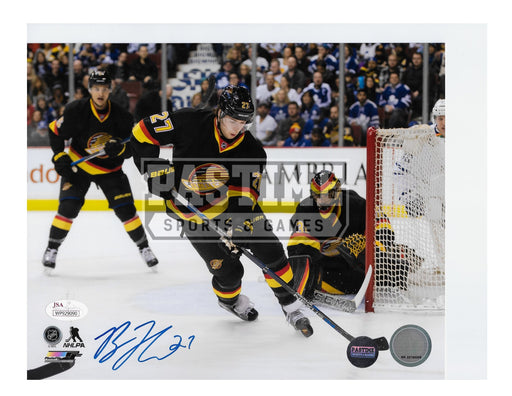 Ben Hutton Autographed 8X10 Vancouver Canucks Home Jersey (With Puck) - Pastime Sports & Games